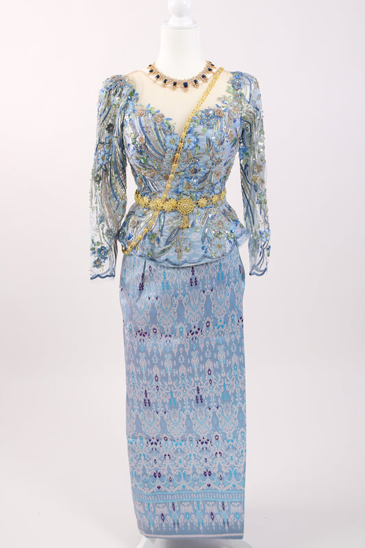 Floral patterned dress on a mannequin against a white background