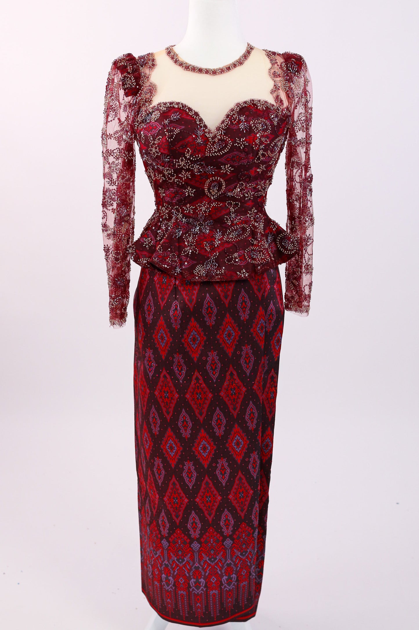 Red patterned dress on a white background