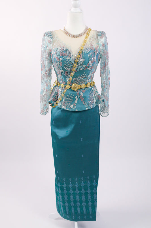 Teal traditional outfit with a matching skirt on a white background