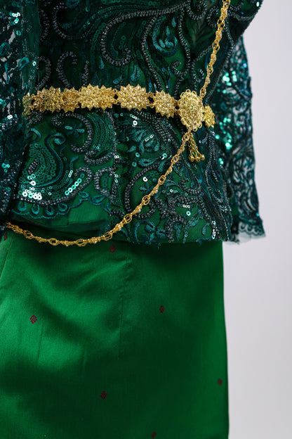 Green embroidered garment with gold accents on a white background