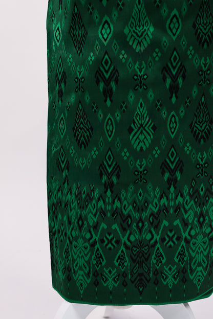 Green patterned fabric on a white background