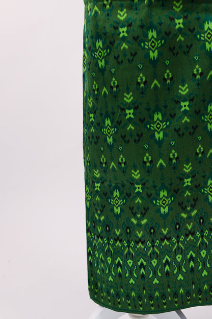 Green patterned fabric on a white background