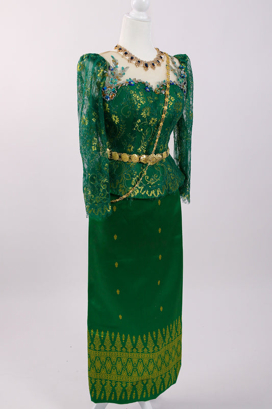 Green traditional outfit with intricate patterns on a white background