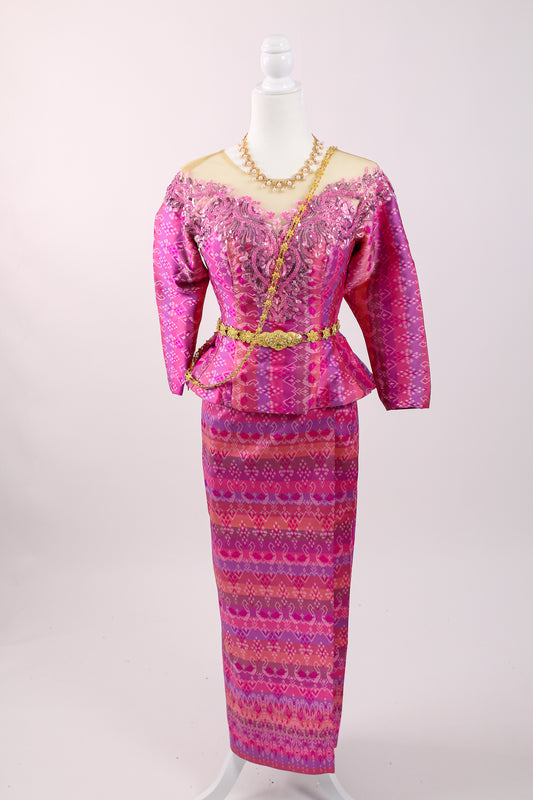 Pink patterned dress on a mannequin against a white background