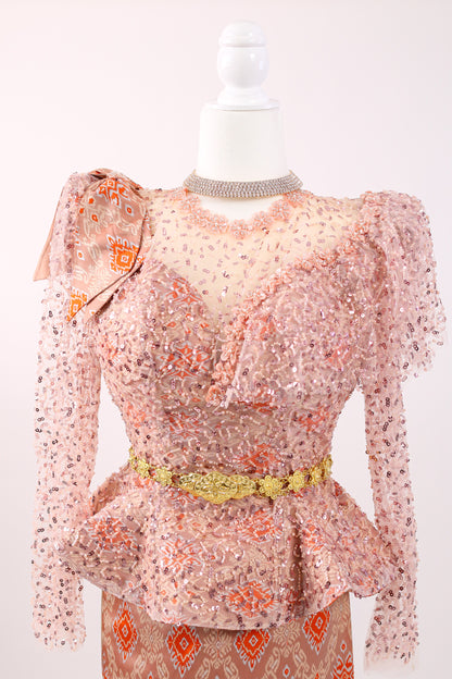 Sheer floral dress with long sleeves on a mannequin against a white background