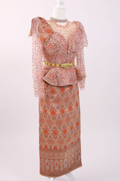Two-piece outfit with a patterned top and skirt on a mannequin against a white background