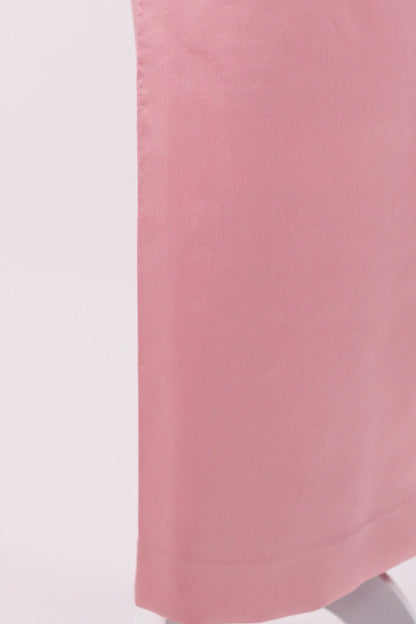 Pink skirt on a mannequin against a white background