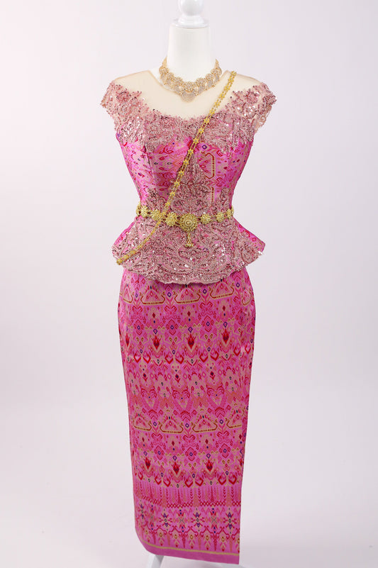 Traditional pink and gold outfit on a mannequin against a white background