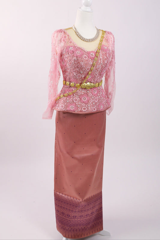 Traditional pink and gold outfit on a mannequin against a white background