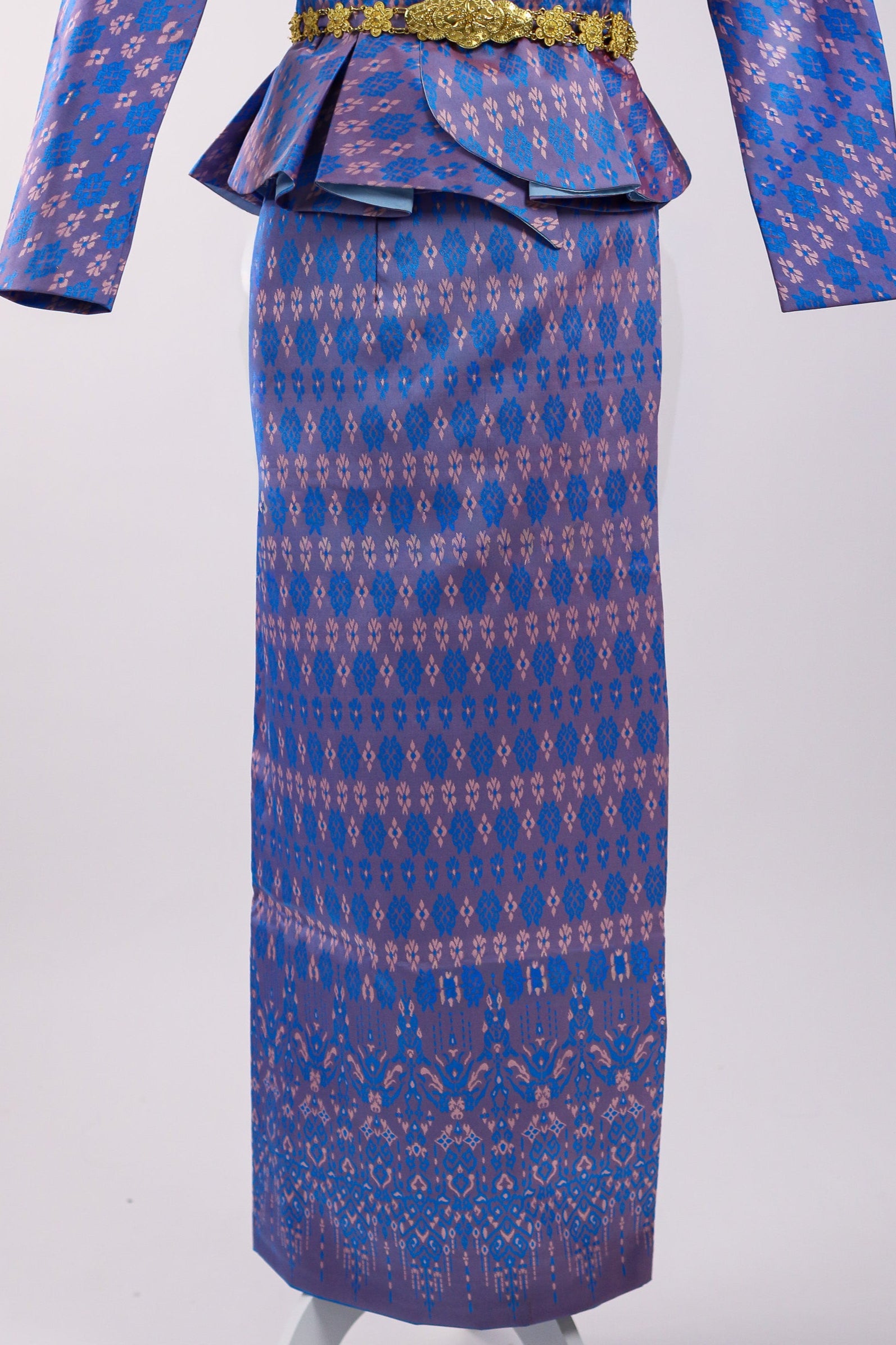 Blue patterned dress with a peplum top on a white stand