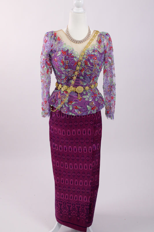 Purple patterned outfit with a matching skirt on a mannequin against a white background