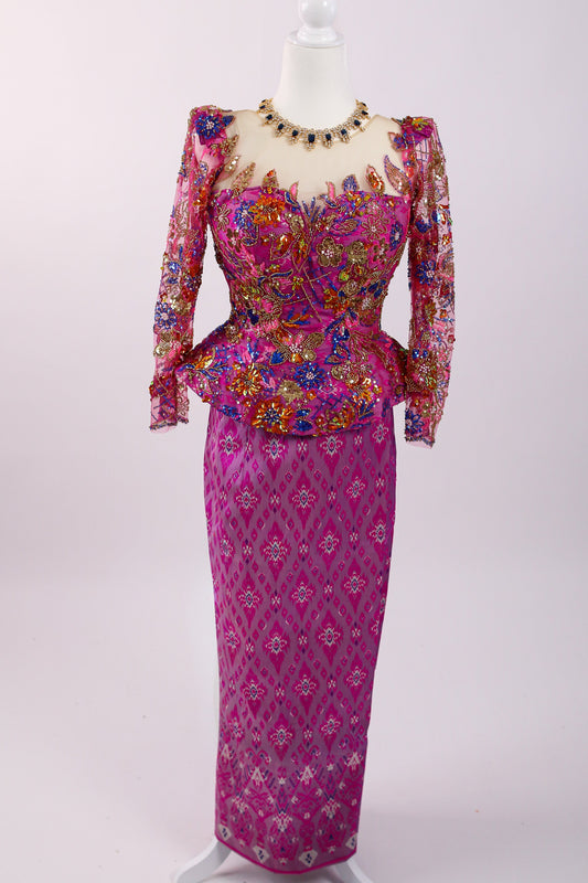Colorful traditional outfit on a mannequin against a white background
