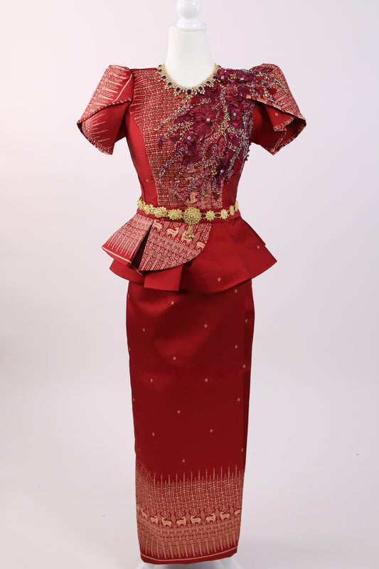 Red traditional outfit with gold embellishments on a white background