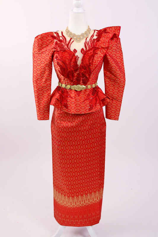 Red patterned dress with gold accents on a mannequin against a white background
