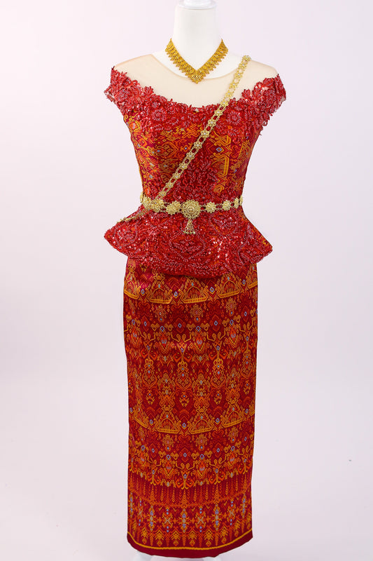 Red and gold traditional outfit on a mannequin with a white background