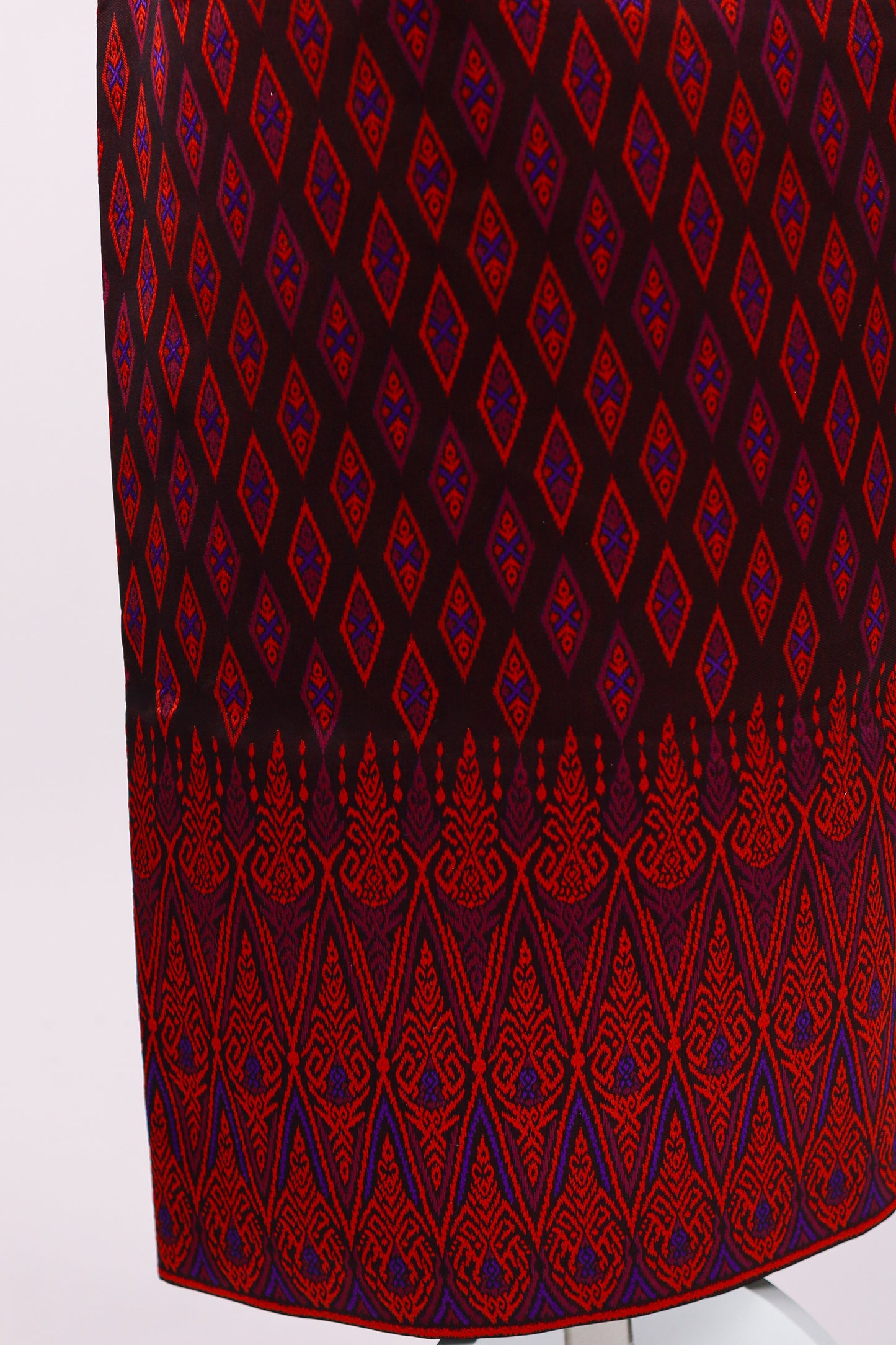 Red and blue patterned fabric on a white background